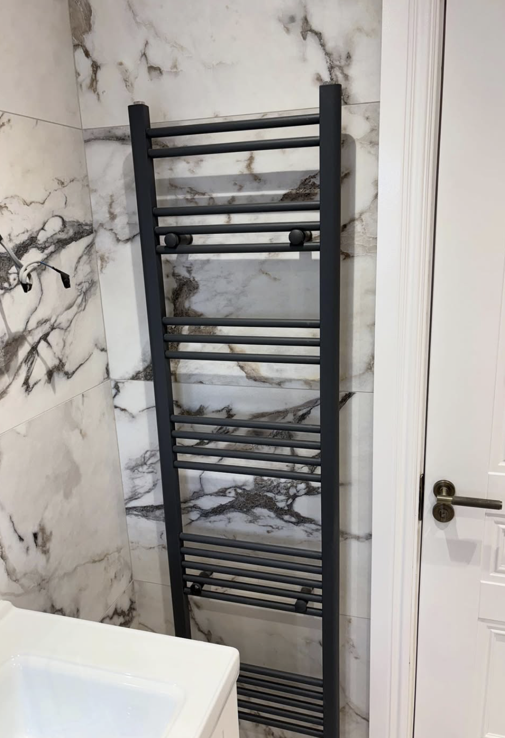 Heated towel rail installation